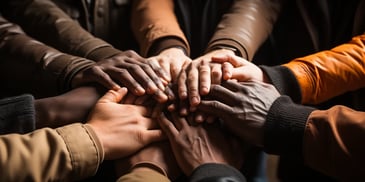 a group of hands on top of each other