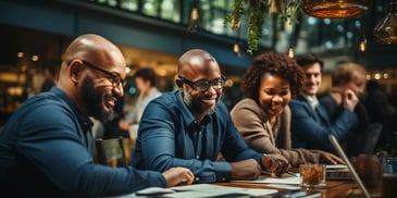 a group of people sitting at a table