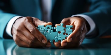 a close-up of hands holding a puzzle