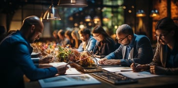 a group of people sitting at a table