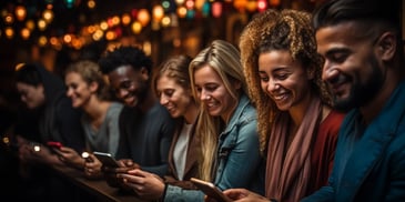 a group of people looking at their phones