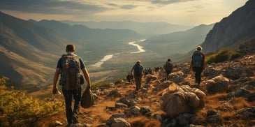 a group of people walking on a mountain