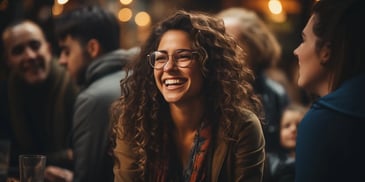 a person smiling with curly hair