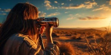 a person looking through a telescope