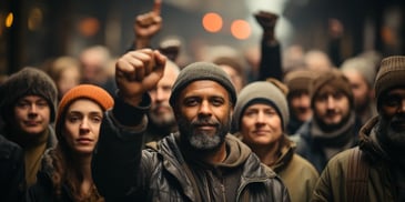 a group of people holding their fists up