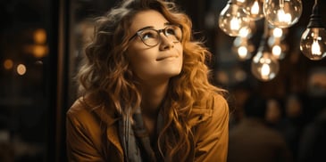 a girl looking up at lights